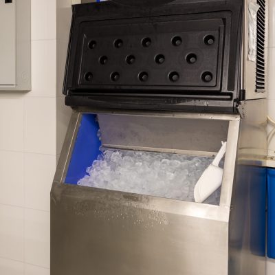 Ice cubes store in ice making machine for clean product. Ice cube maker. Cube ice machine. Suitable for small beverage shops.